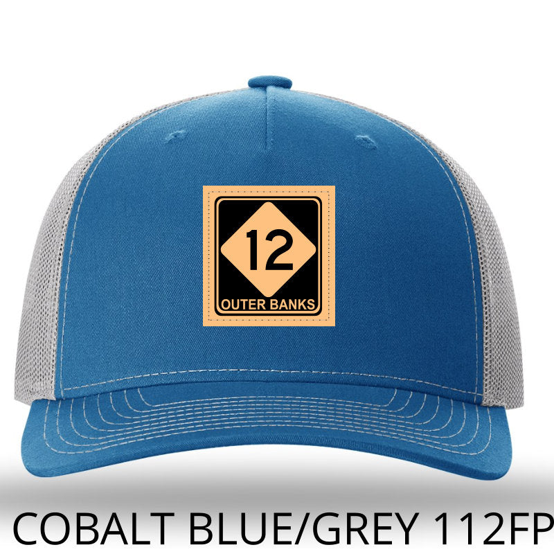 OBX-Highway 12 Leather Patch Trucker Hat- Cobalt Blue-Light Grey Richardson 112FP Lost Wando Outfitters. Outer Banks Highway 12 - Lost Wando Outfitters