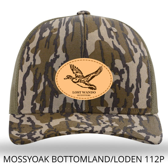 Load image into Gallery viewer, Wood Duck Heather Camo-Mossy Oak Bottomland/Loden Leather Patch Richardson 112P Hat Lost Wando Outfitters - Lost Wando Outfitters
